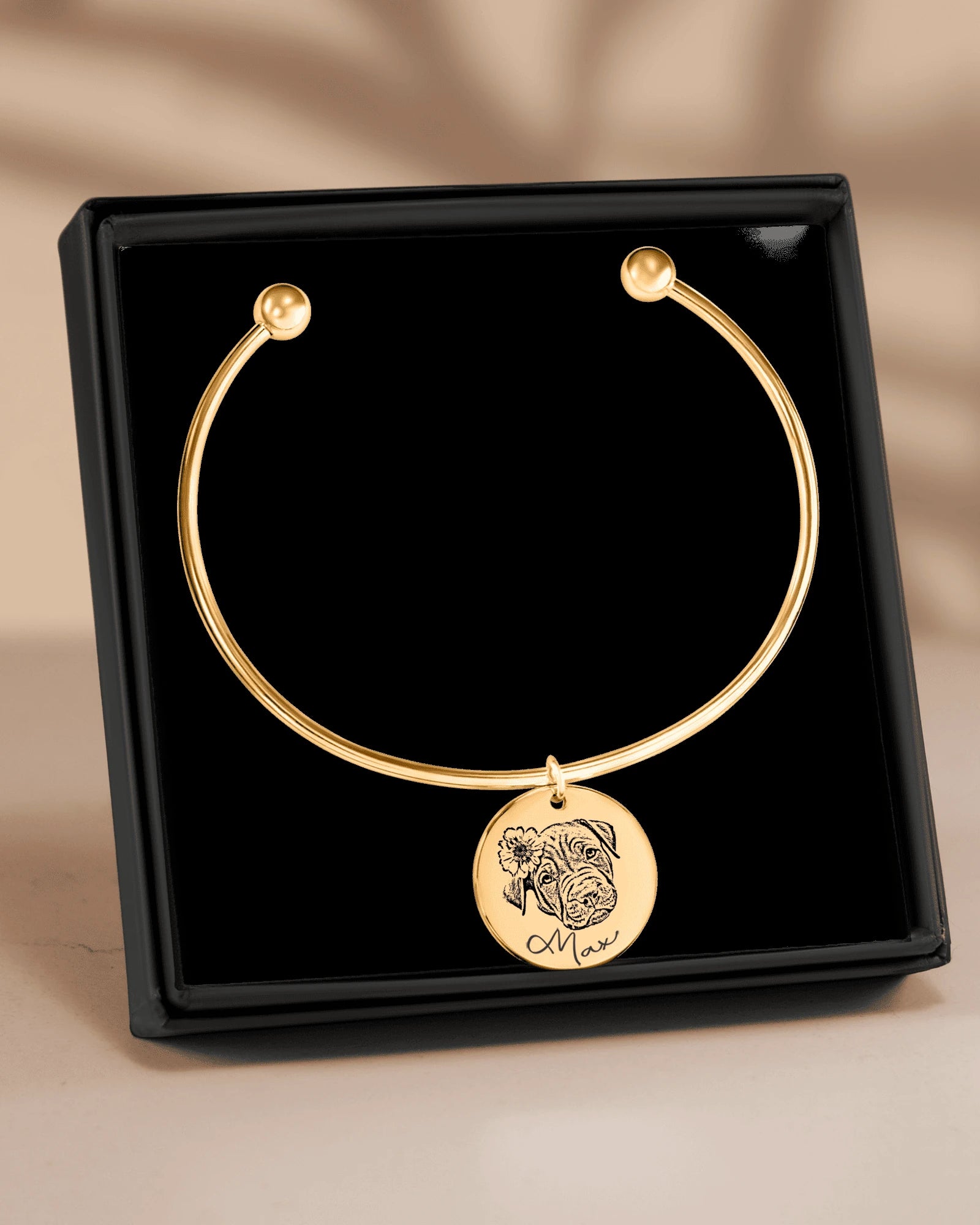 Personalized engraved pet bracelet charm in warm natural light